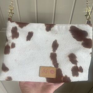 Stylish Cow Print Clutch with Gold Accents